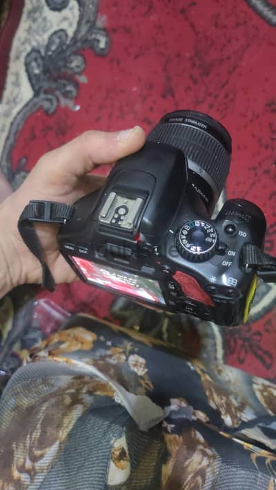كاميرا كانون +فلاش خارجي شاشتو تاتش +2بطاريه وشاحن البطاريات الاصلي