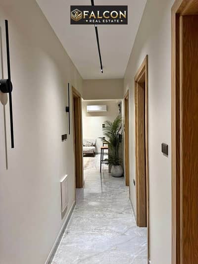 Apartment for sale, hotel finishing (3 rooms), inside “a complete British neighborhood” in New Cairo