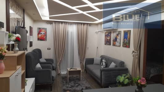 For rent, a furnished hotel apartment with 2 bedrooms in b12 Madinaty