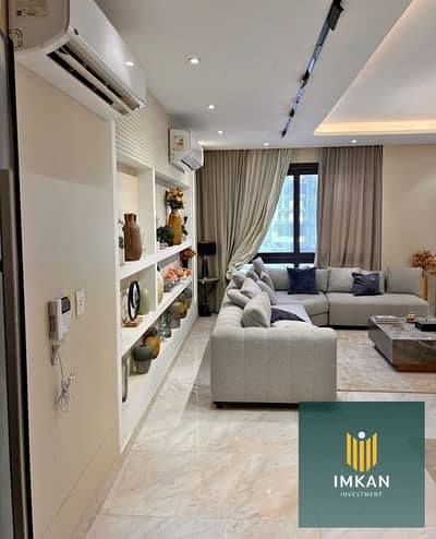 Apartment for sale in Arabesque, Fustat, ready to move in, with a down payment of 600,000, super deluxe finishing and a view of a large green area.