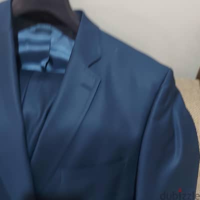 بدله  اورجينال وارد الإمارات ماركة KONZZIمقاس ٥٦ رجلر