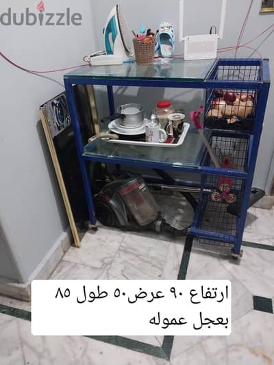 استاند عموله المقاس مكتوب عليه بعجل متحرك. متاح ف التجمع الاول