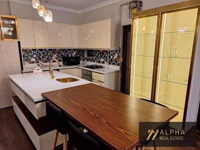 شقة بحديقة للبيع في Lake View Residence القاهرة الجديدة التجمع الخامس بالقرب من الجامعة الامريكية والجولدن سكوير مفروشة بالكامل موقع مميز
