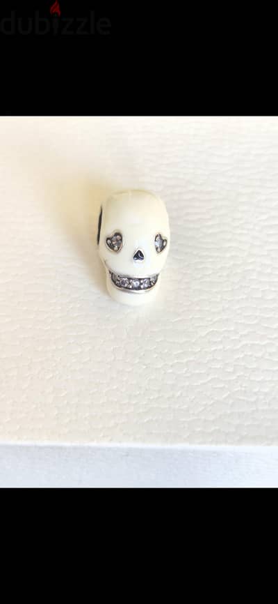 low-in-the-dark Sparkling Skull charm.