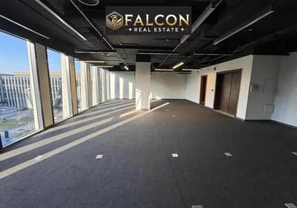 office glass façade amazing location-view lowest price + payment plan for limited time in front of Cairo Festival next to Mivida-Monorail station 90th