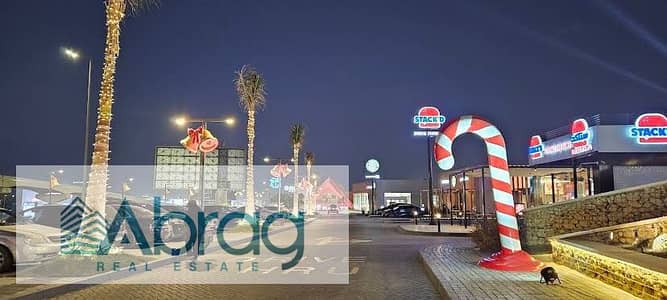 For sale, a commercial shop in installments on 26th of July Axis directly inside West Mark Mall Sheikh Zayed