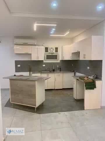 Unfurnished apartment with garden for rent, including kitchen and air conditioning, in Katameya Gardens Compound, Fifth Settlement