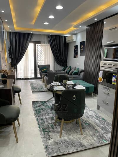 Furnished apartment for rent on the ground floor with a private garden in the Selya Compound, the administrative capital, hotel-style furnishings
