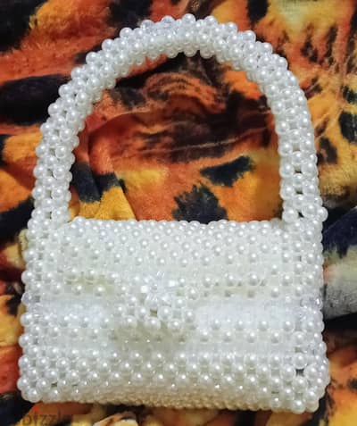 شنطة خرز لولى صناعة هاند ميد