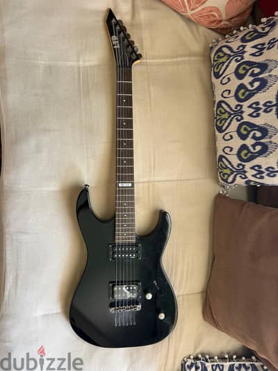 Electric Guitar black used string instrument.