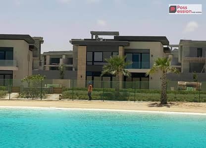 Two-bedroom chalet 120 sqm for sale in Silver Sand Ora North Coast, Phase B, fully complete, close to the sea with a direct view of Crystal Lagoons Si