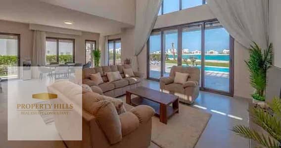 At a low price, the last villa in the coast is equipped with air conditioning and kitchen, overlooking the lagoon and sea in the most distinguished and upscale village Azha Ras Al-Hikma, with a wide area divided over 10 years, close to Fouka Bay