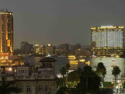 للايجار اول سكن تشطيب فندقي فيو رائع قرب فندق شيراتون للسكن الراقي والمميز بالدقي