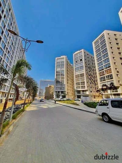Apartment for sale in Compound One Katameya 231 meters half finishing garden view in a distinctive tower