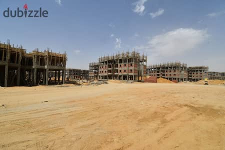 Land for sale in Beit Al Watan, Fifth District, Fifth Settlement  Prime location near Mohamed Bin Zayed Axis and the Middle Ring Road.  Land area: 664