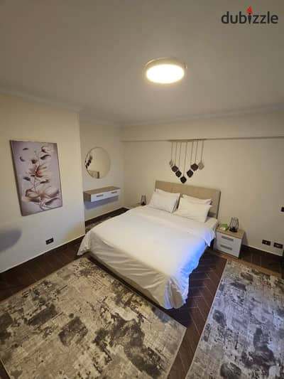 Furnished apartment with hotel-style furniture in Green 3 Compound  In front of Arkan Plaza Mall, Americana Plaza, and 3D Hypermarket, near all the mo