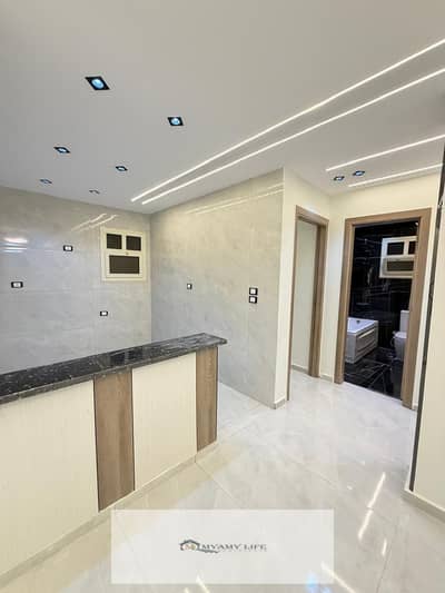 Just 3 minutes walk from the entrance of the gate and the most luxurious sites at the Pyramids Gardens for sale, a 165-meter façade apartment, excellent loading, super lux, first residence, fourth official floor above it a floor