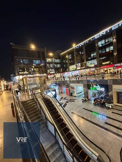Commercial shop, 61 square meters, for sale with immediate occupancy in the prestigious Town Center Mall in Shorouk City, next to Dar Misr and opposi