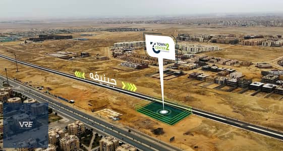 محل تجارى للبيع في الدور الارضي علي البلازا بخصم لونش 10% علي محور جينيفه افضل لوكيشن في مدينه الشروق وبمقدم يبدا من 0% وتقسيط يصل حتي 100 شهر