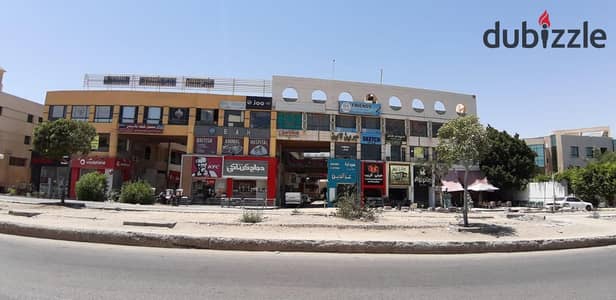 للبيع او البدل محل 34 متر في مول جمجوم   بمدخل الحي المتميز ٦ اكتوبر   يطل علي جامعه مصر   وعلي بعد دقيقتين من مول العرب