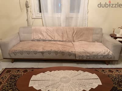 Used beige expandable sofa
