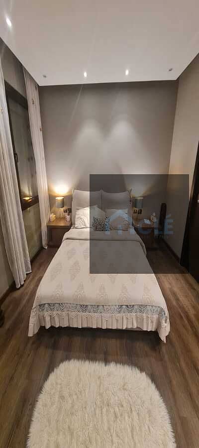 Prime Location Luxury Fully Furnished Apartment for sale in Eastown , New Cairo ,All rooms equipped with Split A/C hot / cold - Nanny room with Toilet