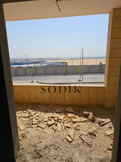 Apartment for sale in Obour City, 9th District, Taha Hussein Street, near University Street, overlooking the main road, second balcony, semi-finished,