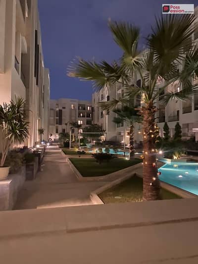 A premium living and guaranteed investment opportunity — Fully finished apartment for sale directly facing The Spine by Talaat Mostafa  .