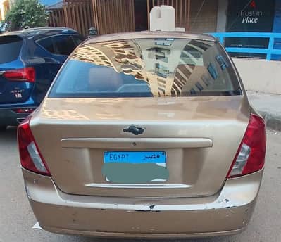 شيفروليه اوبترا توماتيك 2006محتاجه سمكره فيها بارومه. خارجي وبطاحه جوه
