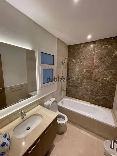 Mivida Apartment, Al Tagamo, for rent with furniture, ground floor with a garden overlooking the swimming pool