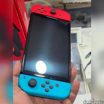 Nintendo switch oled with 4 games and pro controller