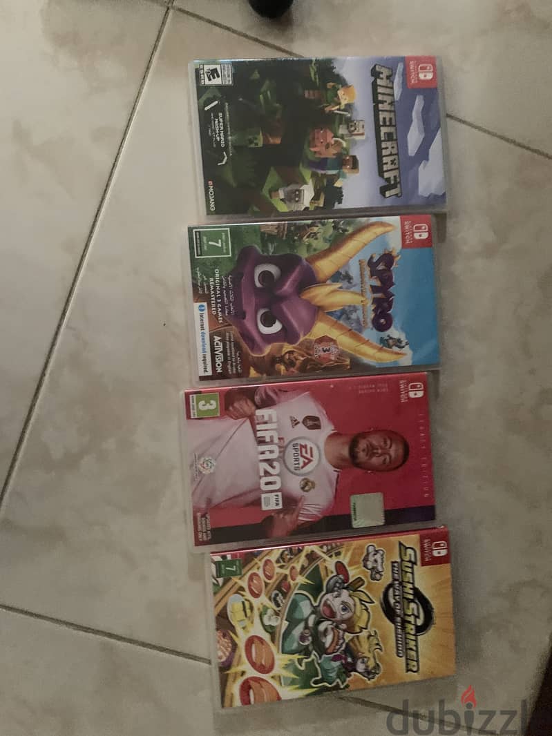 Nintendo switch oled with 4 games and pro controller 1