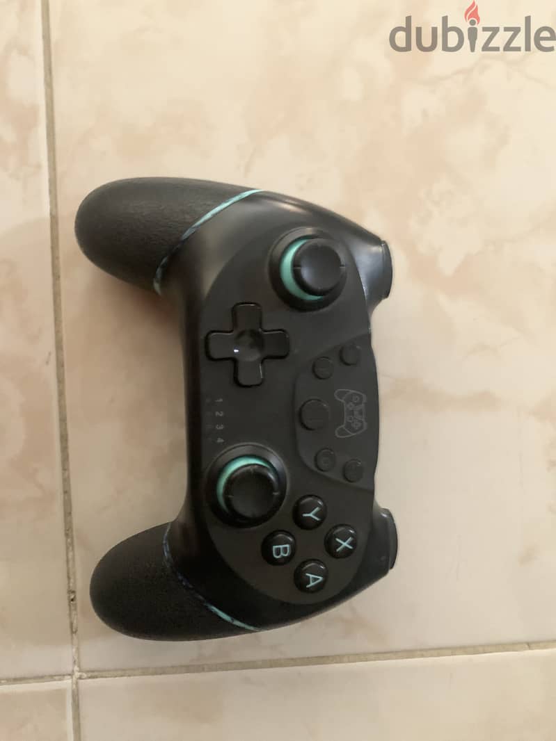 Nintendo switch oled with 4 games and pro controller 2