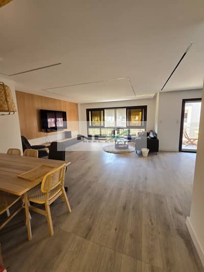 For sale in Madinaty, a 200m² apartment with high-end, ultra-super-luxurious finishing, wide garden view, including kitchen and air conditioning, in a