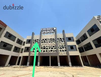 مول بلازا علي شارع السنترال الرئيسي بجوار الجامعة الروسية ومستشفي بدر