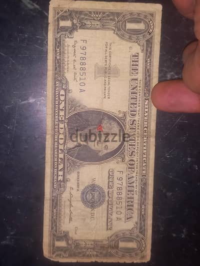 1 silver dollar.  عملة ورقية) ١ دولار فضي)