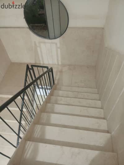 Apartment for rent for a family, garden view, super lux finishing, distinguished location from Al Ahly Club Street and Abu Dawood Al Zahiri