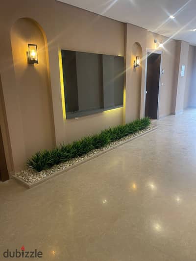 Ground floor apartment with a garden of 177 m in Village West Compound - fully finished with air conditioners - resale with installments at a very spe