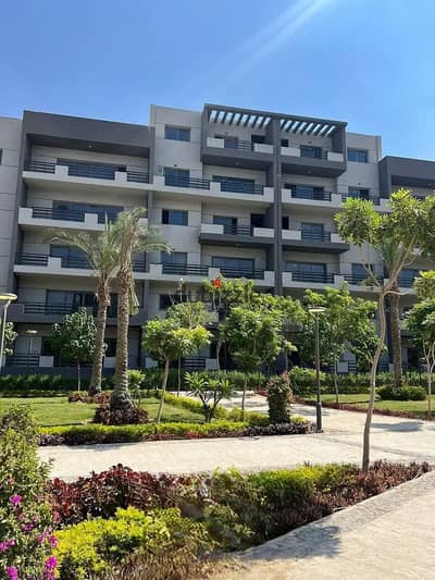 Immediate delivery of a fully finished apartment with a garden and panoramic views of green spaces in Studa Sheraton Compound, near Cairo Airport.