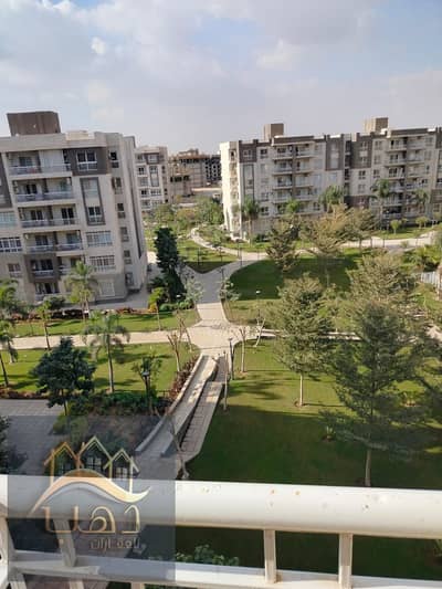 For sale in my city, a 107m apartment B12 with a very nice garden view, a distinguished floor in a location that couldn't be better, steps away from the mosque, the market, and services in my city, New Cairo.