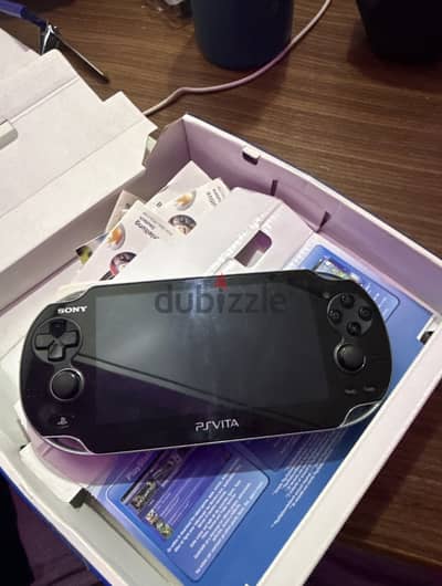 PS Vita console, USB cable, PS Vita carrying case,
