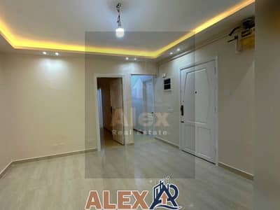 Apartment for rent with a distinctive area in Kafr Abdu kitchen with cabinets