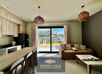 Furnished hotel apartment with air conditioning, sea view, delivery in a year – in the North Coast | Opportunity for investment with strong returns and hotel management next to Marassi, Sodic, and Hacienda White