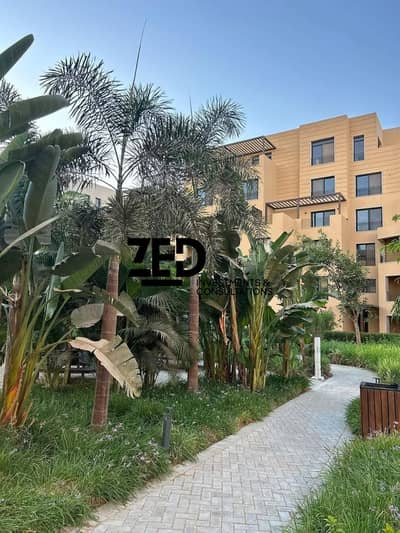Apartment for sale with distinctive equipment and air conditioning from Orascom - 174 meters +94 garden O west immediate delivery cash Tulwa phase fully finished less than the company's price - Owest by Orascom