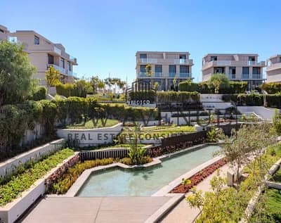 Ground apartment with garden overlooking landscape and water features ready to move including maintenance and clubhouse Il Bosco New Capital