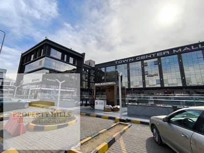 Shop for sale, rent 120,000 EGP per month, ground floor in an operating mall