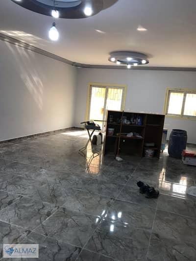 Unfurnished 230 sqm apartment with garden for rent in Al Qarnafel Villas, First Settlement, near Al Rehab.