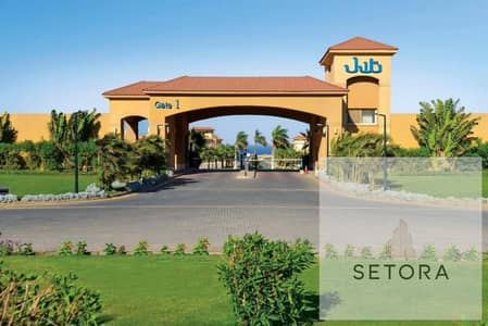  Luxury chalet for sale in Telal Ain Sokhna, fully finished with air conditioning and kitchen, direct sea view with an attractive view, and with conv