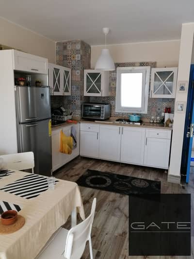 Chalet for sale (resale) | Lowest price, fully furnished and equipped, in Mountain View Ras El Hekma – Greek Island View phase, directly on the sea