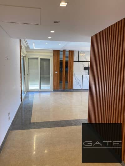 Apartment for sale in New Giza Compound, overlooking the rock and lake, ultra-super-lux finishing with air conditioning.